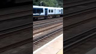 450089 and 450011 leaves Weybridge for Southampton Central