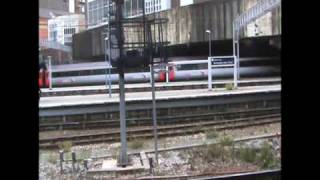 AXC 43366 ad 43378 departs Birmingham New Street.