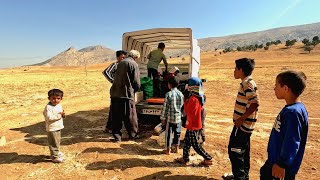 Buying fruit from ambulatory seller by grandfather for nomadic family