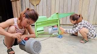 The girl is really skillful when she repairs the broken corn sheller by herself.