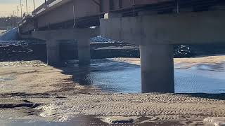 Tidal bore breaching under new bridge @ Moncton NB, Canada. January 3, 2022. January 3, 2022.