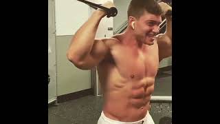 Young muscle hunk Joshua Taubes working out his godlike biceps