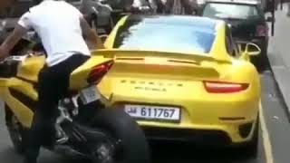 Porsche 911 Turbo S Reverses Into Motorcycle Rider