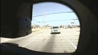 Shocking moment distracted driver speeds into the back of a c op car