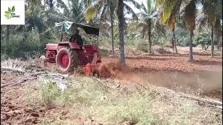 Mahindra 475 rotavator plowing the land