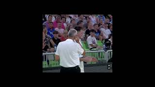 Luka Doncic assisting while arguing with opponent coach