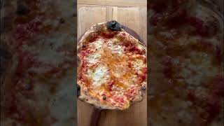 The making of a Baking Steel cheese pizza.