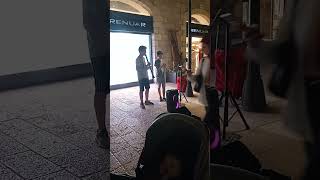 STREET PERFORMERS IN MAMILLA MALL AT NIGHT