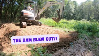 fixing a duck pond after the DAM WASHED OUT