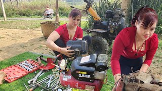 The genius girl repairs and restores the tractor.