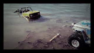 #Axial SCX10 RC rock crawlers #Willys Jeep winch rescuing Ford Bronco "Dirty Bucker" from lake