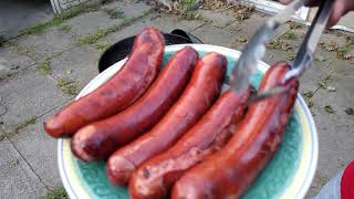 BBQING HEAVY on the weber 22" charcoal grill steaks,chicken, beef sausages,carrots and jalapenos!