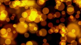 Bright Golden Circles on a Dark Animated Background. Relaxing Screensaver. Free Version Footage.