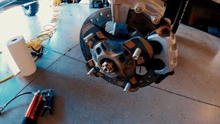 Greasing wheel bearings on a Polaris RZR XP 4.