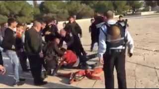 Israeli soldiers beating a Turkish tourist in Al Aqsa - 1/1/2015