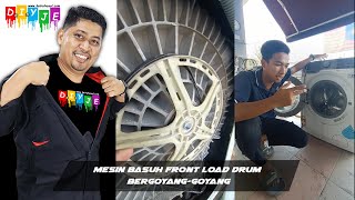 Mesin basuh frontload drum bergoyang-goyang