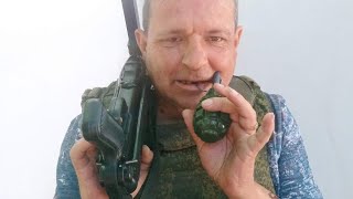 Russians close up throws hand grenade at Ukrainian trench