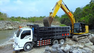 CAT 320GC Excavator Overloading Rocks Truck From The River Flow