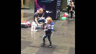 Street performer playing on paint bucket as a drum set !