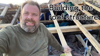 One man roofing an old Italian villa in Tuscany