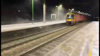 Snowstorm spectacle: Trains glide through Acton Bridge