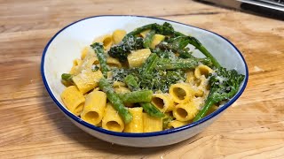 Rigatoni with summer vegetables and a light pink sauce.