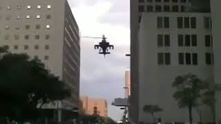 Three AH-64s in maneuvers surprise civilians in the middle of the city.