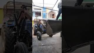 tractor loader used as ladder during fabrication work. tel 9840692811