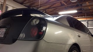 Dodge Charger spoiler installation on an Altima