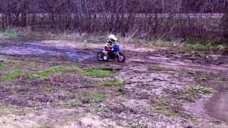 A 3 year old mudding on his dirt bike