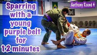 A 12 minute roll with a young 2 stripe purple belt