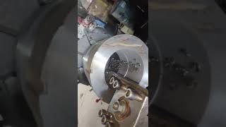 lathe operating on die head for pvc