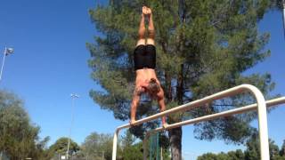 Handstand walk on parallel bars