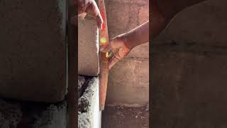 How to ensure the block is set on plumb. #blocklaying #architecture #masonry #buildingconstruction