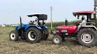 New Holland 4x4 pulling arjun605 loaded tralla in mud. #newholland5620 #newholland3630