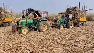 John Deere tractors pulling Sugarcane loaded trolley