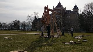 Assembling a Medieval Trebuchet on the Quad at USU