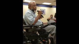 Theo speaks about disability oppression at a civil rights forum