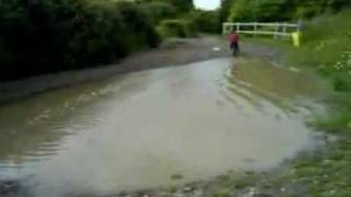 4yr old boy + bike + massive puddle =