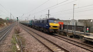 Class 90 passing Biggleswade on a charter service with royal train loco 67005 on rear - 18/12/21