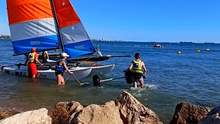 Beach in Fos-sur-Mer, girls on a catamaran