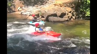 Kayaking a standing wave on the the Gull River in minden Ontario