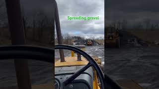 Spreading gravel with a John Deere 410B and a case 621