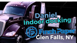 Coaching student Daniel into dark indoor dock at finch paper Glen Falls, NY