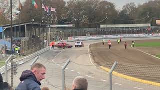 Banger racers at Foxhall stadium exit pit lane for a race