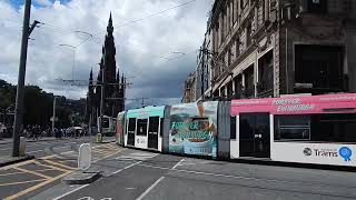 Edinburgh Tram in busy  Princes Street, with the Sir Walter Scott monument beyond, August 2023