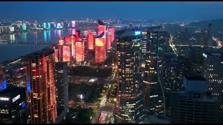 Qianjiang New Town is adorned with skyscrapers illuminated with vibrant lights,