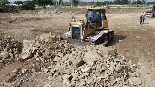 Great action mighty Power Extreme Dozer SHANTUI DH17C2 working push sand for  construction project.