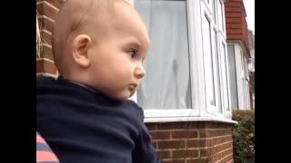 Baby slaps mum at the shock of a snowflake