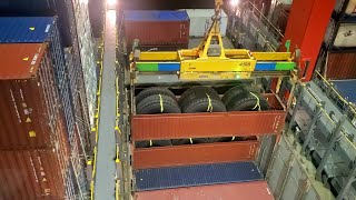 time to wake up, LOADING HUGE TIRES BELOW DECK OF THE SHIP